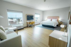 a hotel room with a bed and a tv at Hampton Inn & Suites Mission in Mission