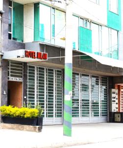 a building with a hotel indian sign on it at Hotel Milán in Duitama