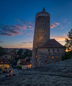 a lighthouse on top of a building at dusk at Magische Welt in Bautzen