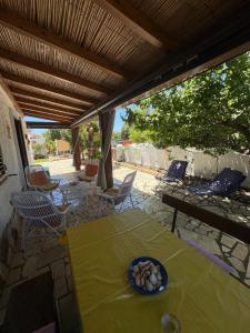 a table and chairs on a patio at Villa Gino in Santa Lucia