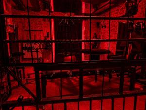 a red room with chairs and tables in it at Caporizon - La Damoiselle in Chancelade