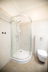 a glass shower in a bathroom with a toilet at Nysa Gubin in Gubin +85 photos