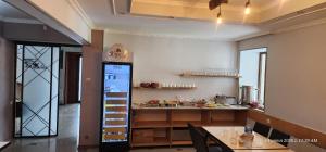 a kitchen with a counter and a table in a room at hotel "Riverside Mestia" in Mestia