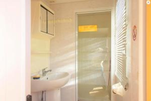 a white bathroom with a sink and a shower at St.Nicholas Ranch Corfu in Benitses +33 photos