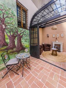 a room with a painting of trees on the wall at Palazzo Ravenna in Ravenna