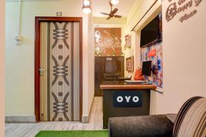an open door to a room with a desk with a computer at Hotel O White Sapphire in Jādabpur +42 photos