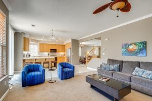 a living room with a couch and a table at Pool Table & Home Gym! Manteca Group Getaway in Manteca