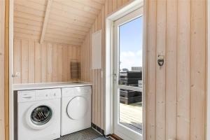 a washing machine in a room with a window at 507-Lemvig-Lyngsletten-11 in Lemvig