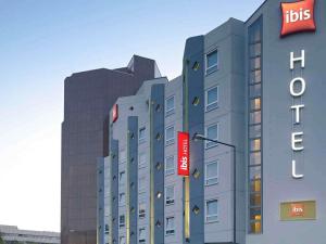 a building with a hilton sign in front of it at ibis Köln Centrum in Cologne