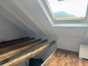 a skylight in a loft conversion with a window at Loft Adrimar in Santoña