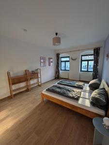 a large bedroom with a large bed in it at Marktblick in Radeburg