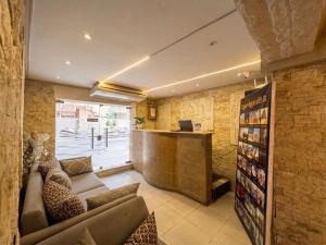 a living room with a couch and a bar at Explore Pyramids View in Cairo