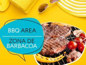 a steak on a grill with tomatoes and bananas at MIRABELLA SOL CARIBE SUITES playa LOS CORALES in Punta Cana