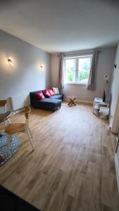 a living room with a couch and a table at Crandford in Dublin +1 photo