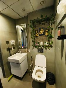 a bathroom with a toilet and a sink at Luxury sup nova in New Delhi