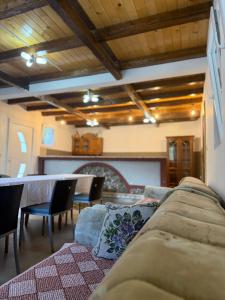 a living room with a couch and a table at DreamHouse Grebaje in Gusinje