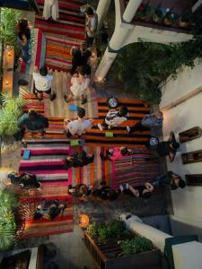 an overhead view of a group of people standing on a staircase at Hotel Pata y Perro in Tarija
