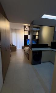 a large room with a bed and a large mirror at aura alraha village in Aqaba