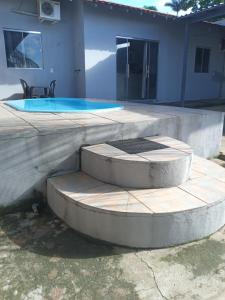 a patio with a swimming pool in front of a house at Alter do Chão Casa 02 in Alter do Chao