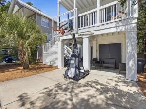 a basketball hoop in front of a house at Dune Our Thing in Blue Mountain Beach