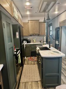 a kitchen with a sink and a counter top at EL Camper KW in Key West