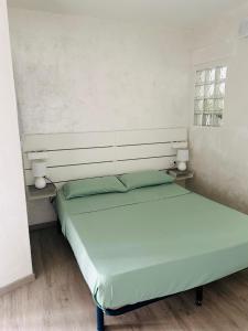 a bedroom with two beds in a room at Casa Vacanza Li Menduli San Teodoro in San Teodoro +13 photos