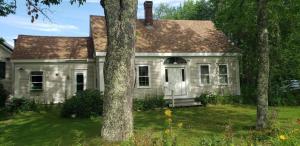 an old white house with trees in the yard at Hawks House Inn in Walpole