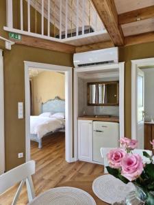 a bedroom with a loft bed and a bed at Seventh Heaven Village Glamping in Rogašovci