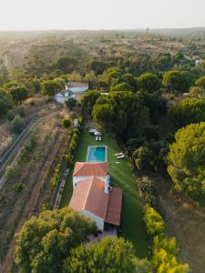 an overhead view of a house with a swimming pool at Monte da Marouca-Mont’Argil in Montargil