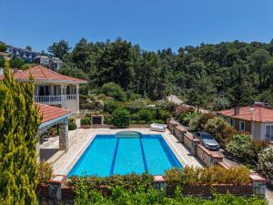 an overhead view of a swimming pool in a house at Private Pool Villa with Garden & Forest View in Fethiye