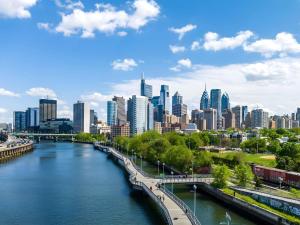 a view of a city with a river and a bridge at Sofitel Philadelphia at Rittenhouse Square in Philadelphia