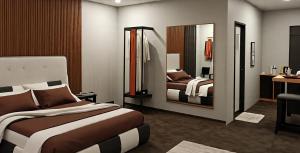 a hotel room with two beds and a mirror at Samal Hillside Inn in Samal