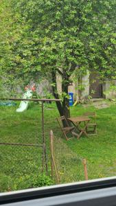 a park with a picnic table and a fence at Studio w kamieniczce in Konstantynów Łódzki +5 photos