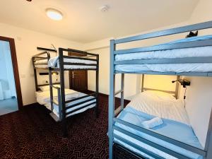 a room with two bunk beds and a hallway at Coopers Lane in Dublin