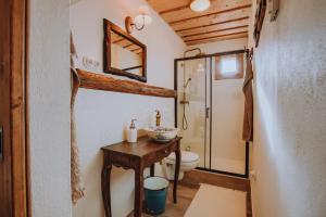 a bathroom with a sink and a toilet in a room at Babičkina Chalúpka in Pohorelá