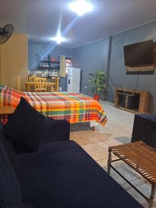 a living room with a couch and a table at Hummingbird Hostel in Ciudad del Este