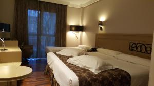 Posteľ alebo postele v izbe v ubytovaní Cumbria Spa Hotel 3* Sup