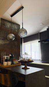 a kitchen with a counter with a bowl on a table at Burgos Spa and Cathedral in Burgos