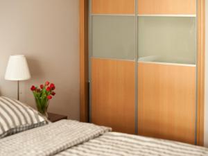 Posteľ alebo postele v izbe v ubytovaní Apartament Witawa 22