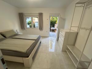 a bedroom with a bed and a staircase in it at My Miracle Stinica in Stinica