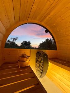an inside view of a sauna with a window at La Fontana Glamping in Caria