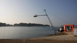 a crane sitting on the side of a body of water at Guesthouse Porec in Poreč