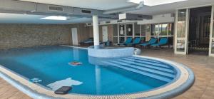 a swimming pool with a shark in the middle of it at T8 Sunset Tihany 19 in Tihany
