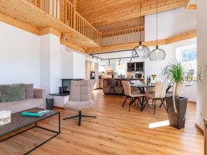 a living room with a couch and a table at Bruggerheim in Niedernsill