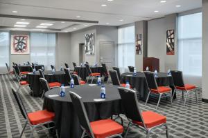 a conference room with tables and chairs and a podium at TownePlace Suites by Marriott Springfield in Springfield +44 photos