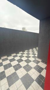 a room with a checkered floor and a wall at Julieta in La Rioja +1 photo