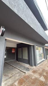 a building with a garage with a parking lot at Julieta in La Rioja