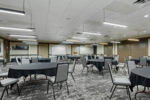 a conference room with tables and chairs and a whiteboard at Best Western Sunridge Inn & Conference Center in Baker City +64 photos