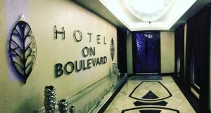 a hallway with a hotel on boulevard written on the wall at Hotel on Boulevard in Johannesburg +13 photos