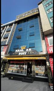 a large building with a store in front of it at Kral As Suite Hotel in Istanbul